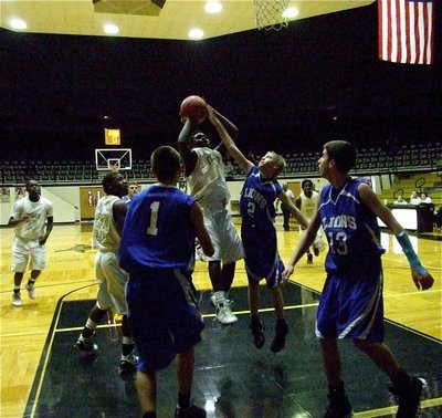 Image: Going up strong  — Italy puts up a shot inside the paint.