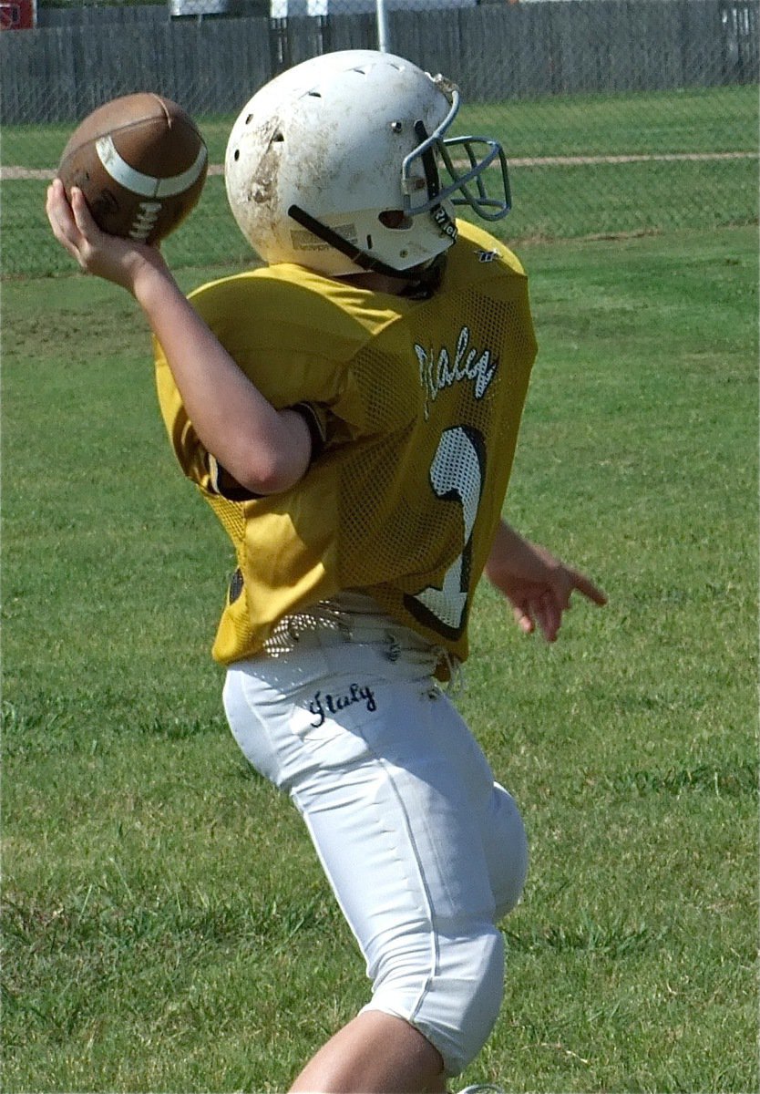 Image: Going deep — John Escamilla steps into the pass.