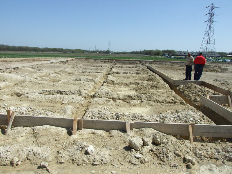 Image: “Upon this rock I build my church…” — Pastor Isaac and the congregation are blessed by God to have this new building.