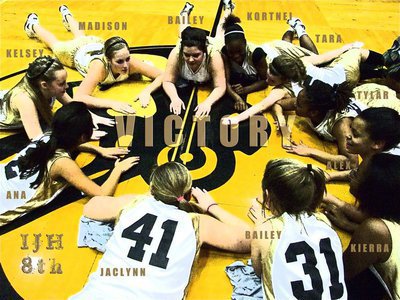 Image: Victory starts here — Italy’s 8th Grade Junior High Girls form a victory circle atop the Gladiator head located at center court inside Italy Coliseum after a big win over Rio Vista, 35-20.