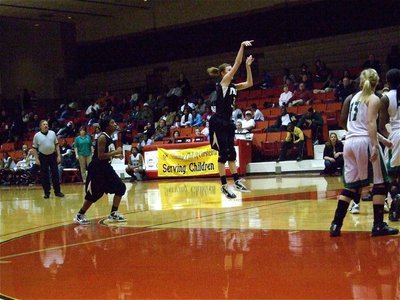 Image: Sure shot — Italy’s Kaitlyn Rossa(3) gets an open look near the top of the lane while Jameka Copeland(5) heads toward the basket for a possible rebound.