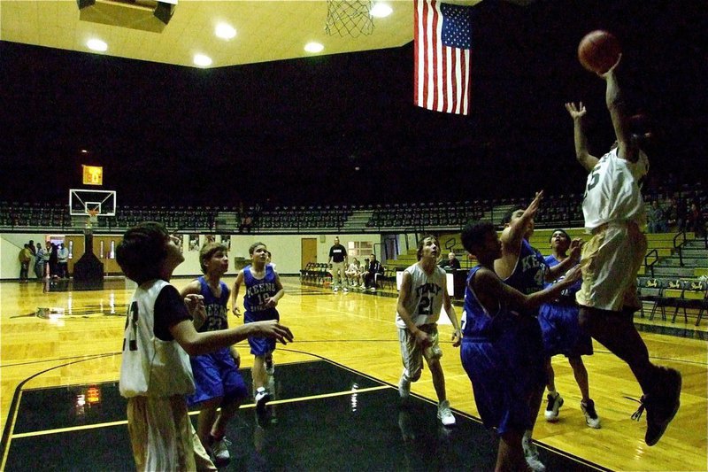 Image: Jaray Anderson(25) helps Italy win a wild one against the Chargers — Jaray Anderson(25) goes up for a shot over Keene’s defense to help Italy’s Junior High “White” team win at the very end, 18-15 in Italy on Thursday.