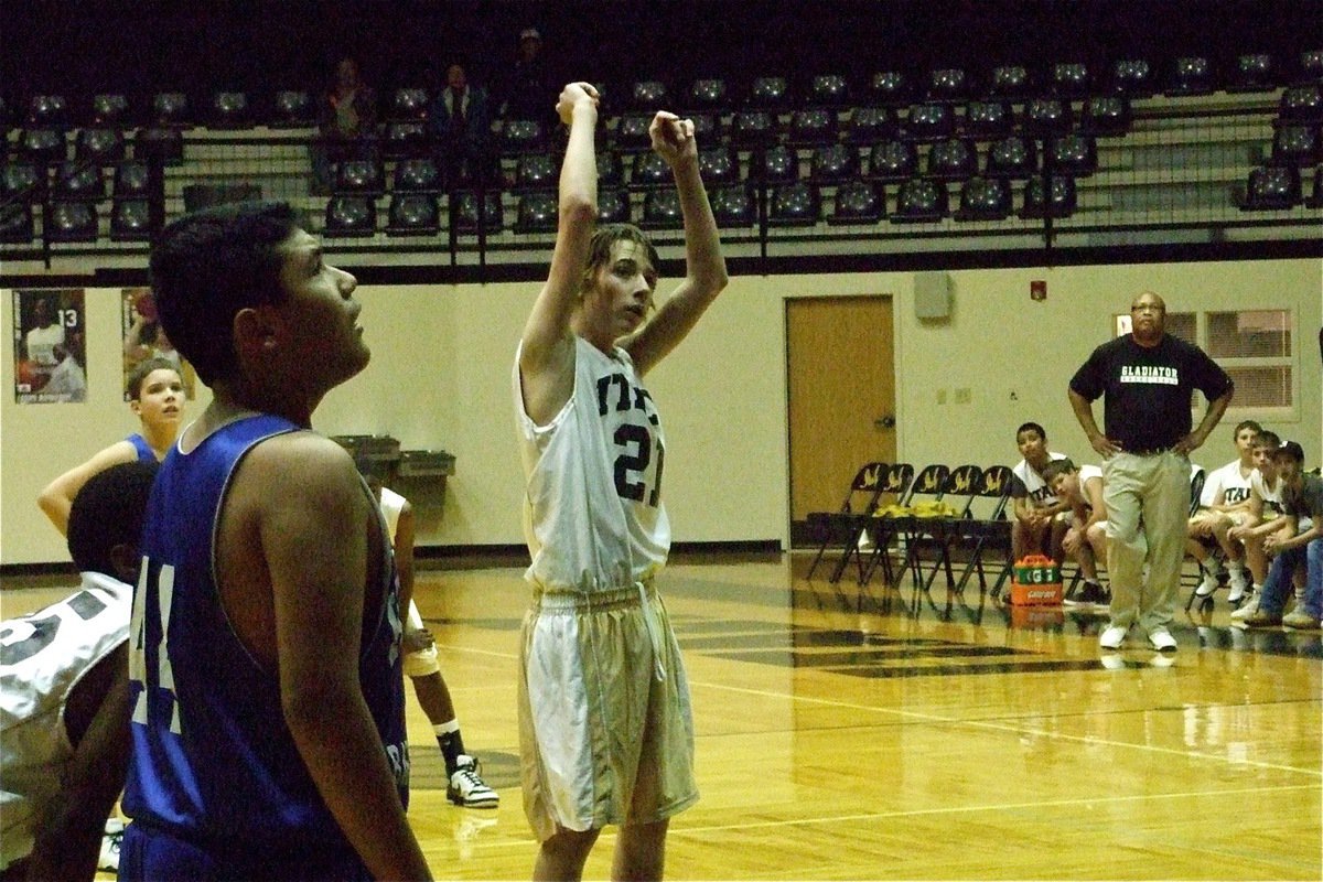 Image: Tie game — Jordan Lemire(21) hits 1-of-2 from the line to tie the game 1-1 against Keene in the first quarter with Italy’s head coach Larry Mayberry, Sr. and his teammates looking on.