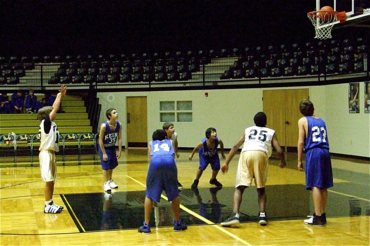 Image: Get in there! — Levi McBride rolls in a free-throw against Keene as Thomas Crowell(4) and Jaray Anderson(25) get ready to rebound.