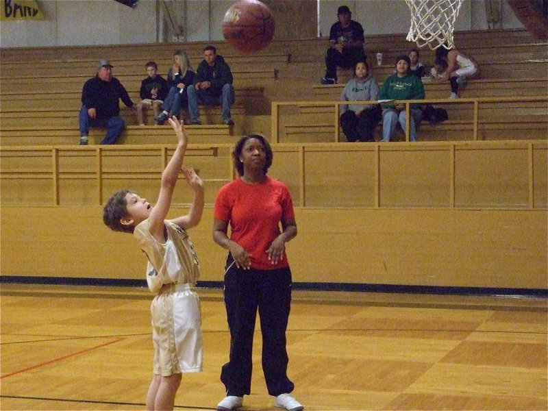 Image: Xander practices — Italy 9’s Xander Galvan(10) practices his shooting form before the game as head coach Deloris Harris observes.