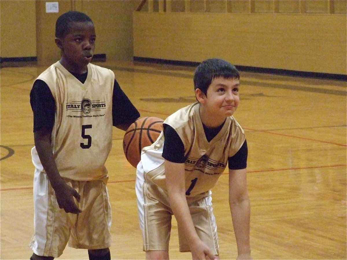 Image: Taron &amp; Gary — Gary Escamilla(1) tries to hold in his excitement before taking the shot.
