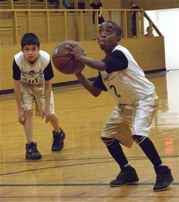 Image: James is at the line — James McIntyre(2) does his best Michael Jordan impersonation before shooting his free throw as Alex Hernandez(10) gets ready to rush in for the rebound.