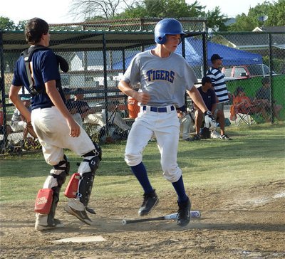 Image: Making a point — Corsicana Tigers-Blue trotted around the bases to score 30-points in their last two games, making a statement.
