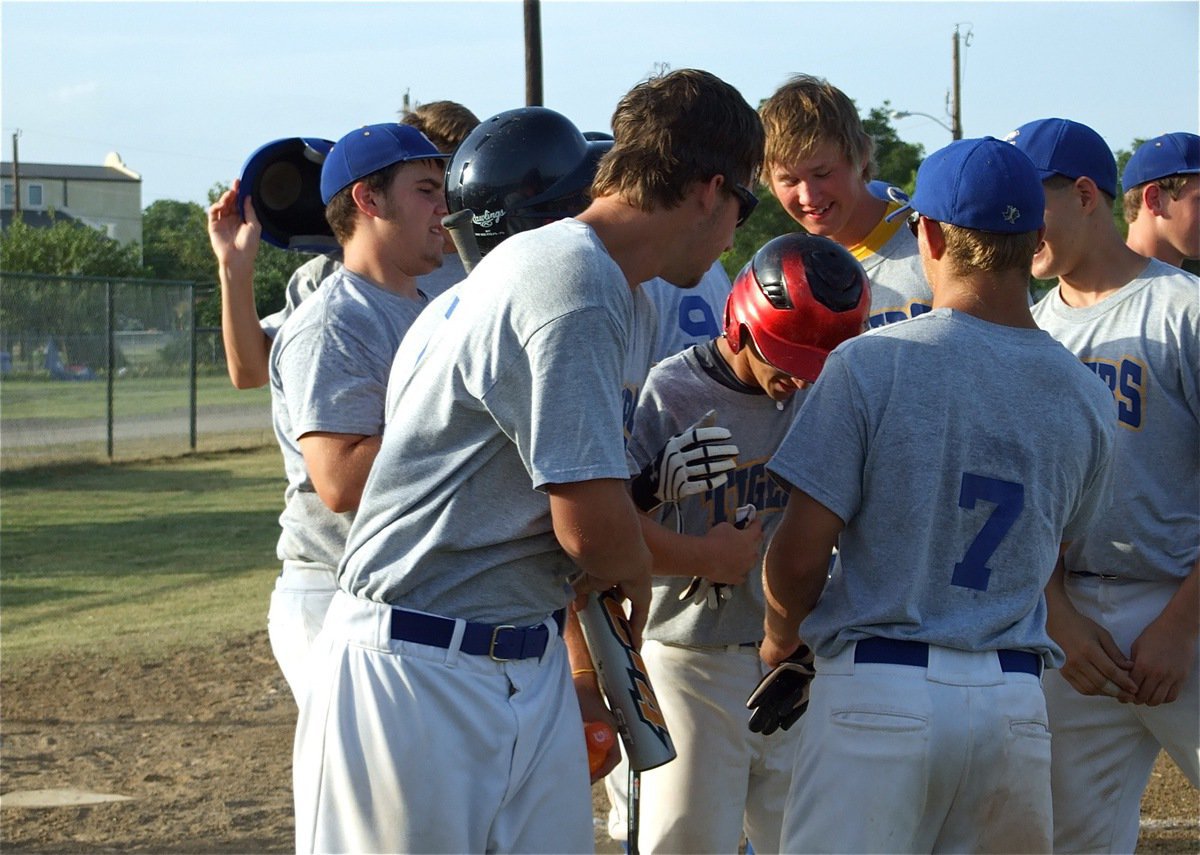 Image: Nice hit! — The Tigers celebrate a solo homerun shot by Blake Whisenet that cleared the left field fence around Field 1 at the Upchurch Ball fields in Italy.