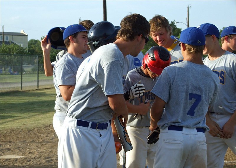 Image: Nice hit! — The Tigers celebrate a solo homerun shot by Blake Whisenet that cleared the left field fence around Field 1 at the Upchurch Ball fields in Italy.