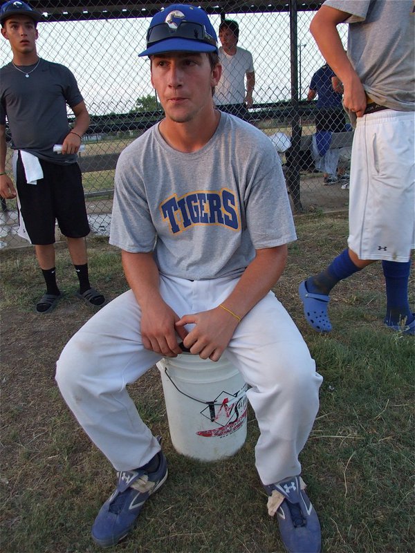 Image: Matt relaxes — Corsican Tigers-Blue first baseman Matt Burns sets on his pedestal after the big win over Teague.