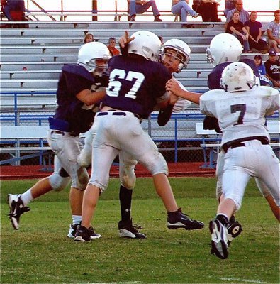 Image: Big play — Ryan Connor completes a pass to Cody Boyd while John Escamilla(7) tries to rescue his quarterback.