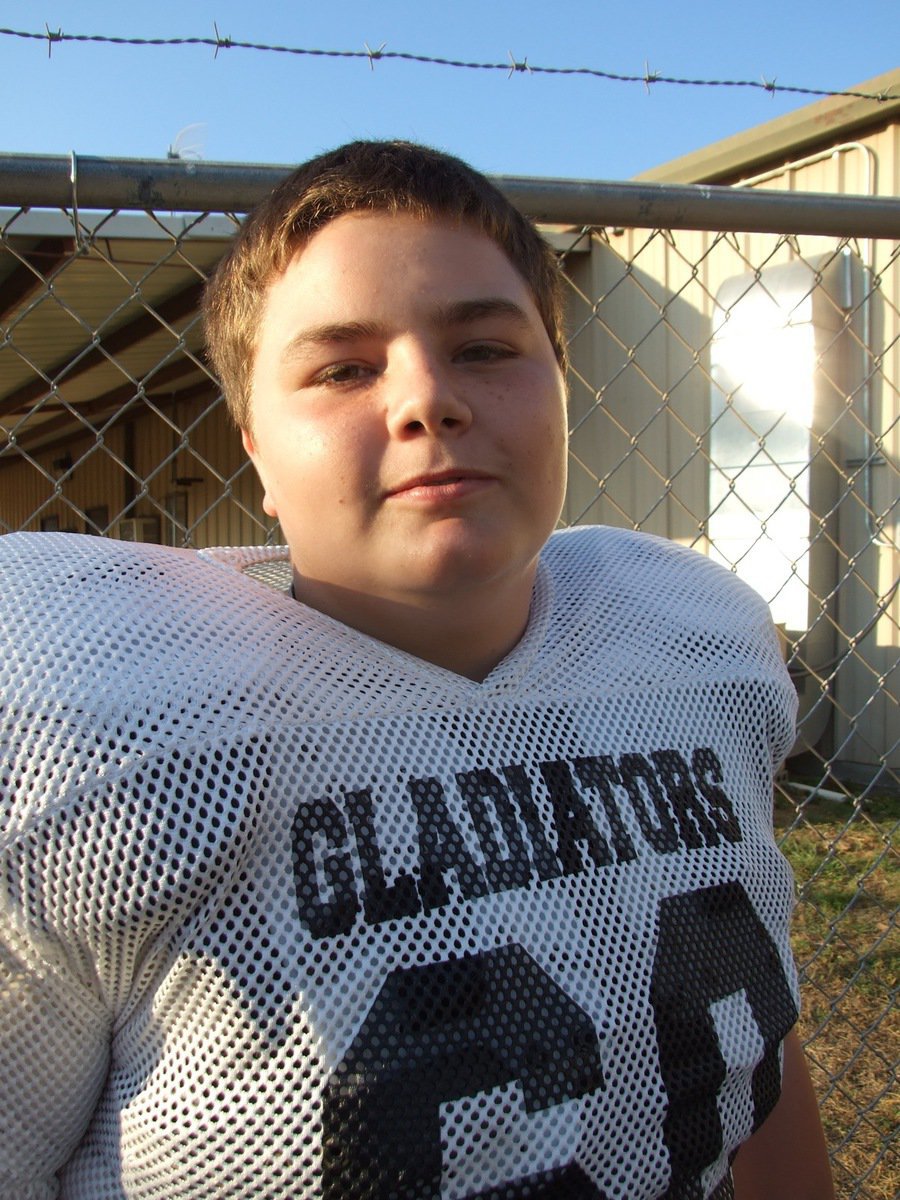 Image: Bales and barbwire — On one side of the fence, Gladiators. On the other side of the fence, Cougars. Italy’s Kelton Bales asks for some wire cutters.