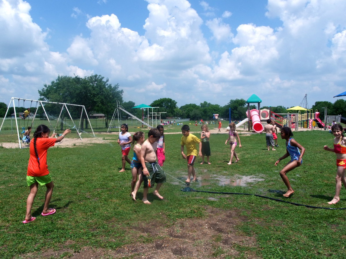 Image: Lets Get Wet — This young man is getting soaked.