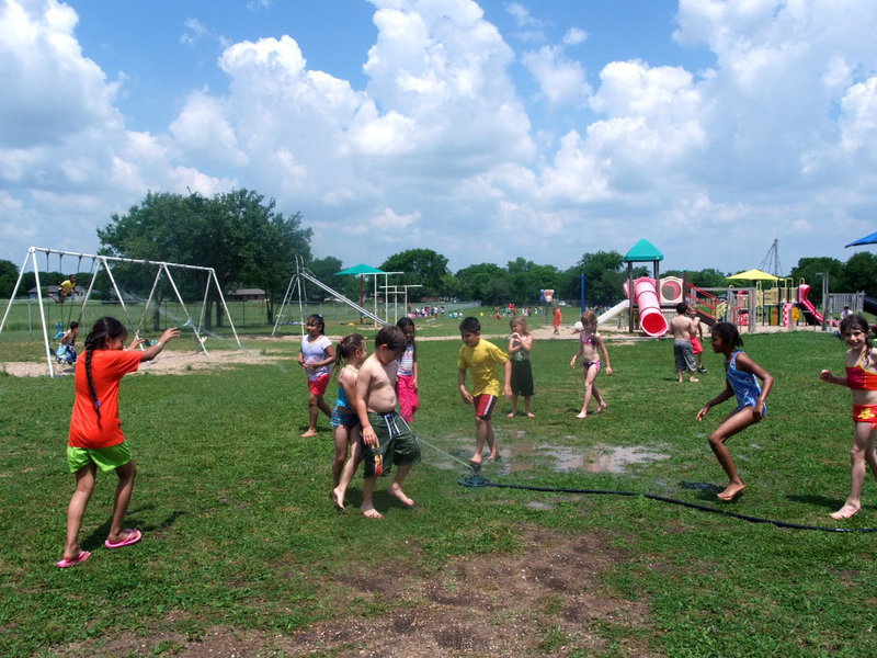 Image: Lets Get Wet — This young man is getting soaked.