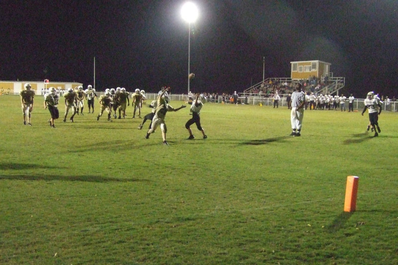 Image: The football is free — The football is up for grabs as it works it way to the endzone.