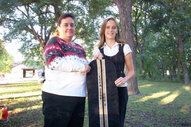 Image: ECEA Top 5 Winner — Courtney Griffith, right, of Midlothian won the Champion Aged Geldings at Halter buckle, along with top five English 10-13 division and top five western division with the black Quarter Horse, Capital Te Strut, who is owned by the Flying Dollar Ranch of Italy.