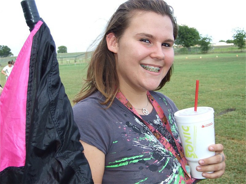 Image: Megan cheeses — Megan Buchanan cheeses for the camera before the Gladiator Regiment Band performs in front of the folks.