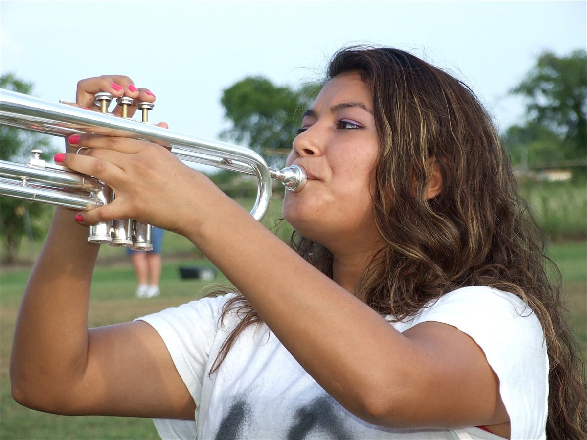 Image: Marisela Perez — Marisela plays while keeping her eyes on the drum majors.