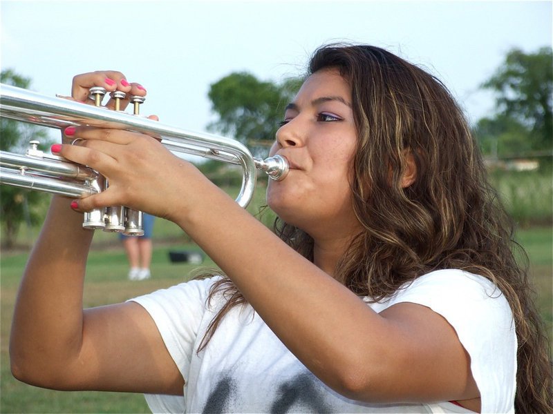 Image: Marisela Perez — Marisela plays while keeping her eyes on the drum majors.