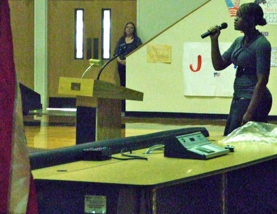 Image: Brianna belts it out — Brianna Burkhalter handles “The Star Spankled Banner” with ease.