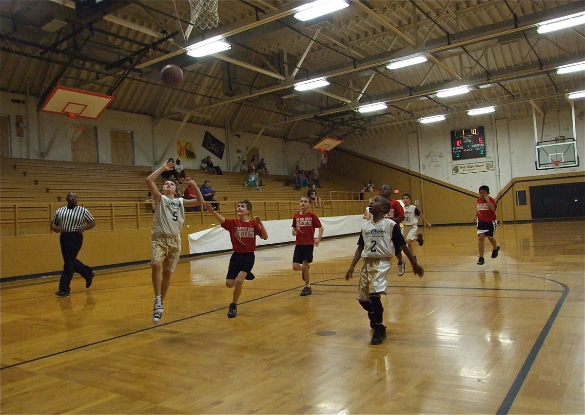 Image: Ryder Itson scores — With teammate James McIntyre(2) in position to rebound, Italy 20’s Ryder Itson(5) finishes the fast break and ends the night with a game-high 13-points.
