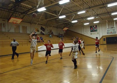 Image: Ryder Itson scores — With teammate James McIntyre(2) in position to rebound, Italy 20’s Ryder Itson(5) finishes the fast break and ends the night with a game-high 13-points.