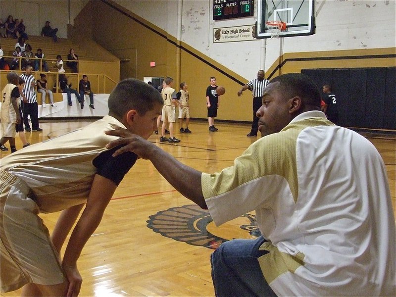 Image: Gotcha, Coach! — Coach Edwin Wallace instructs Gary Escamilla(1) during the game against Hillsboro Black.