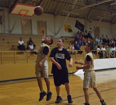 Image: The hook shot — Tylan Wallace(2) flips up a baby hook shot to score 2 of his 8-points on Tuesday as teammate Gary Escamilla(1) was there for the rebound.