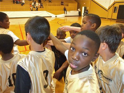 Image: Here we go! — Coach Ken Norwood breaks the huddle with his team before their game against Italy 30.