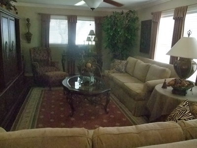 Image: Living Room Remodeled — They not only created a beautiful outdoor living space but they also mastered a beautiful indoor living space. Their home was built in 1920 and Edward and Sharon remodeled their house about four years ago. Edward said, “The only thing left original to house is one door in a bedroom.”