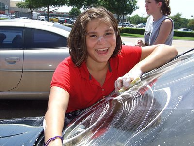 Image: Your so nosy — Desi Brooks buries her nose into her work. Desi hopes to replace the soap on her nose with suntan lotion during spring break next year in Florida while competing in a band competition.