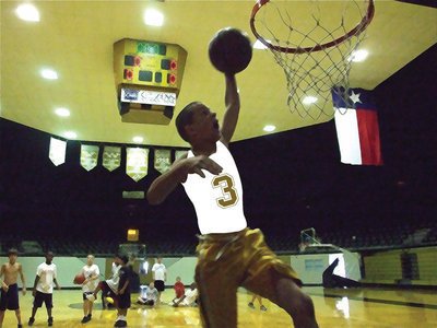 Image: Gary goes for it — Gary Escamilla hammers one down during the slam dunk competition.
