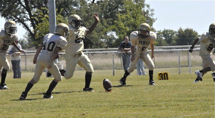 Image: Kenneth kicks — Ken Norwood kicks off after a Majors touchdown.