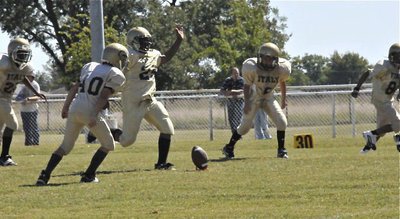 Image: Kenneth kicks — Ken Norwood kicks off after a Majors touchdown.