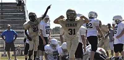 Image: Gladiators’ ball! — Italy recovers an onside kick during the IYAA Majors game against Dawson on Saturday.