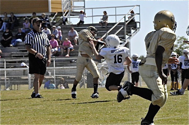 Image: 2-to-1 — Tylan Wallace(2) passes downfield to Kendrick Norwwod(1).