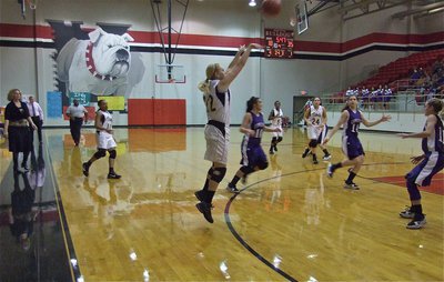 Image: The green light — Megan Richards(22) releases a 3-point shot in hopes of pulling off a 4th quarter comeback.