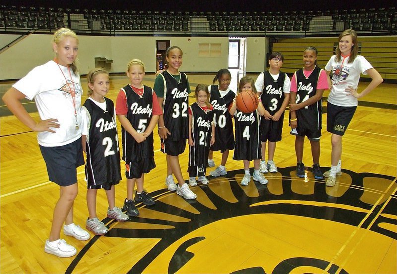Image: “Hoop it up’ with Rich & Ro” campers are in full uniform — (L-R): Coach Megan Richards, Paige Henderson(22), Brycelen Richards(5), Michaela Tarrant(32), Evie Hernandez(21), Destiny Harris(40), Hailey Routson(4), Jenna Holden(3), Emily Cunningham(24) and Coach Kaitlyn Rossa. Not pictured: Peyton Henderson.