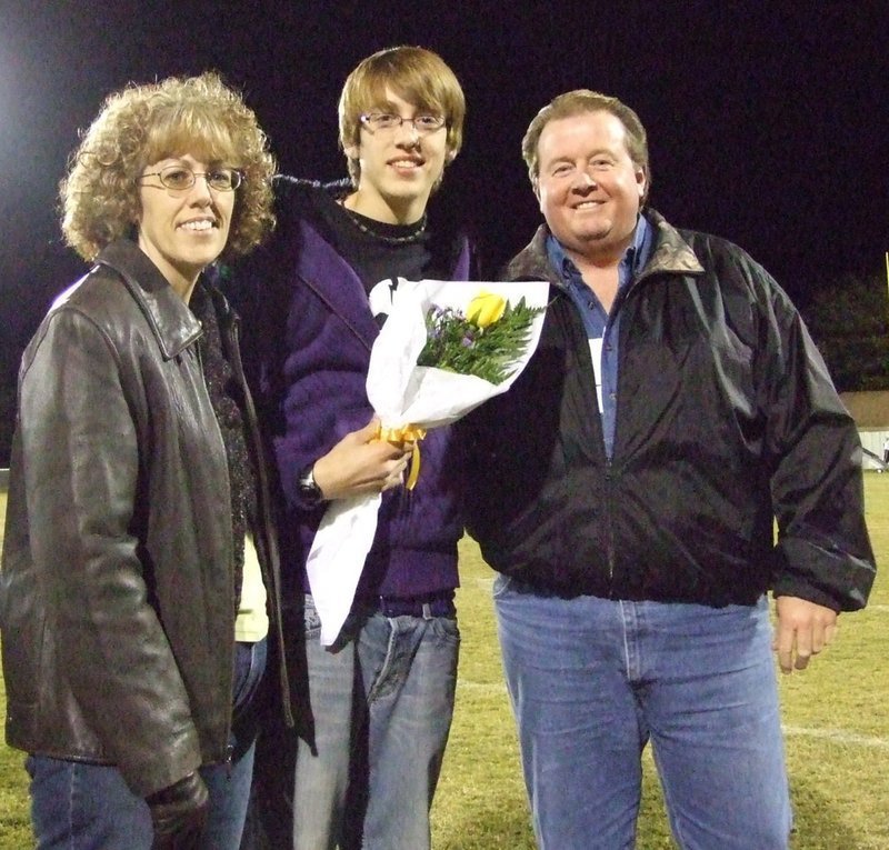 Image: Cory Hughes — Cory was escorted by his mom and dad.