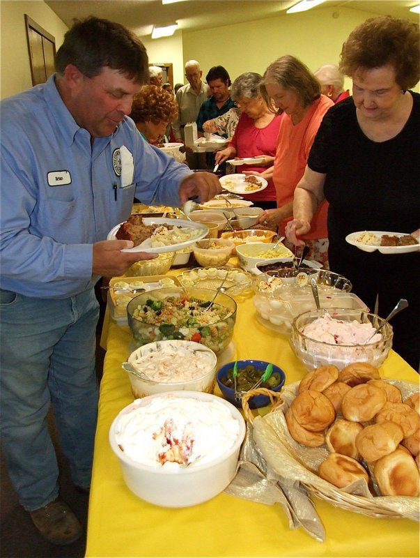Image: Let’s eat! — Precint 3 crew member Brian Mathiowetz joins CBC church members in the lunch line.