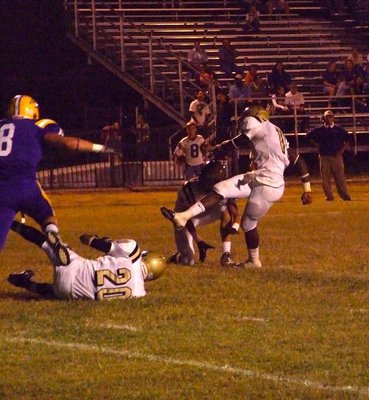 Image: The kick to tie — De’Andre Sephus(20) blocks, Jase Holden(6) holds and Jasenio Anderson(11) kicks thru the extra point to tie the game 7-7.