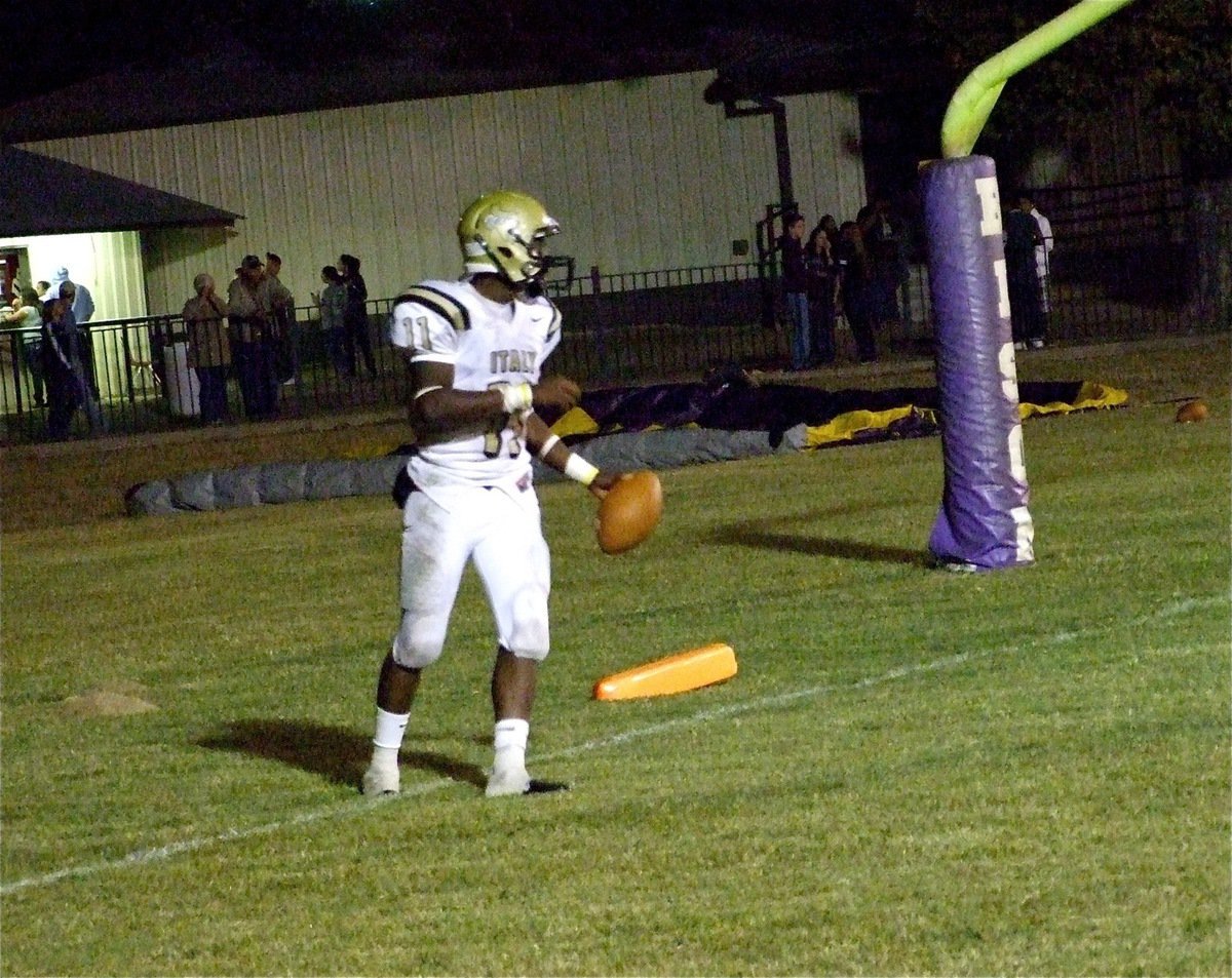 Image: Eleven for seven — Jasenio Anderson(11) scores a touchdown against Buffalo and then kicks thru the extra point.