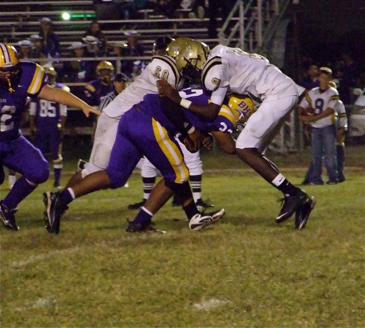 Image: Buffalo runs out clock — De’Andre Rettig(60) and Devonta Simmons(9) combo tackle Dominic Jackson(32) who was inserted into the Bison backfield late in the contest to run out the clock.