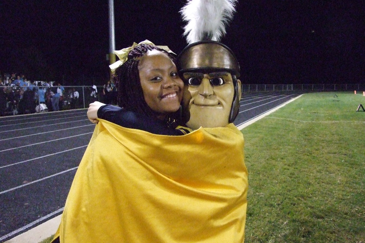 Image: Amber and Bianca — IHS Cheerleader, Amber Mitchell, with Mascot, Bianca Evans.