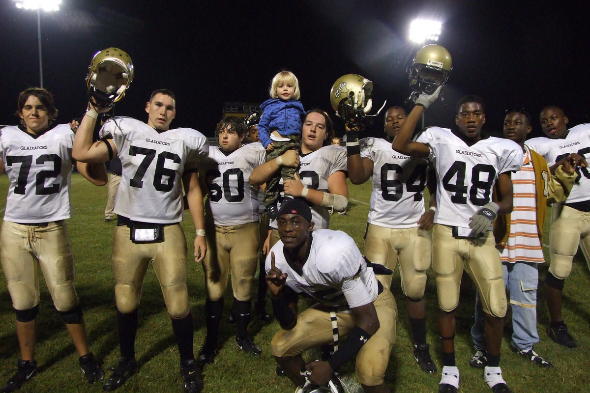 Image: School song — The Gladiators line up for the victory song.