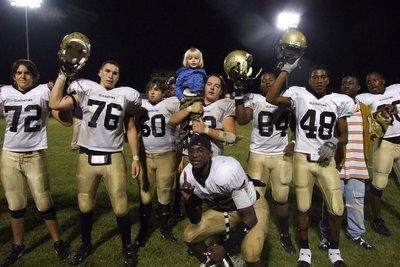 Image: School song — The Gladiators line up for the victory song.
