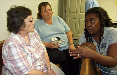 Image: The facts — Sandra Norwood explains to Karen Mathiowetz and Michele Stephens how it was really her that did all the work and not her husband Ken Norwood. Just kidding, Ken.