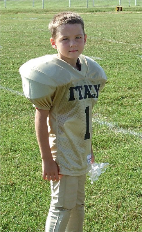 Image: Taylor Sparks — Kindergartener Taylor Sparks receives his gift bag after the Bantam (K-2nd) Homecoming game against Ferris.