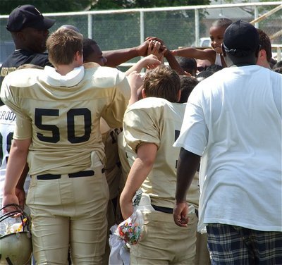 Image: Major victory — The IYAA Majors team celebrates their 12-6 Homecoming win over Ferris at Willis Field in Italy.